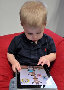 512px-child_with_apple_ipad
